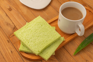 Soft pandan flavored bread and milk coffee