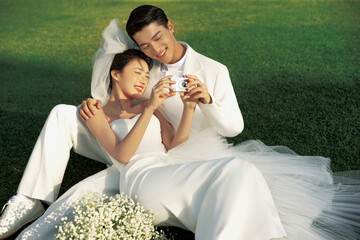 Happy couple enjoying a moment together in wedding attire.