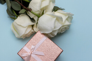 postcard. White roses on a blue background. Banner. Congratulations on March 8, Valentine's Day, Mother's Day, Birthday, Anniversary, Easter, Wedding, Teacher's Day, to women.