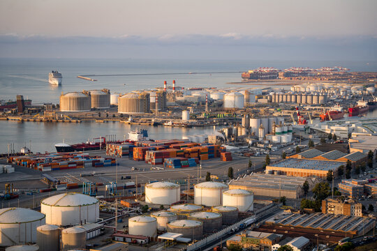 shipping containers and cargo ships in the port of Barcelona. Concept of sea and maritime trade and trade war due to trump tariffs.