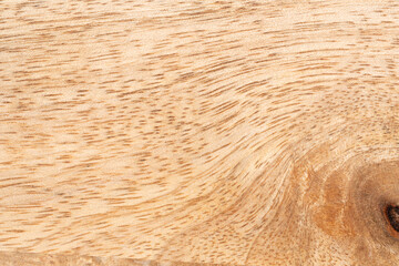 Mango wood texture top view. Kitchen wooden tray background, organic Mangifera indica veneer