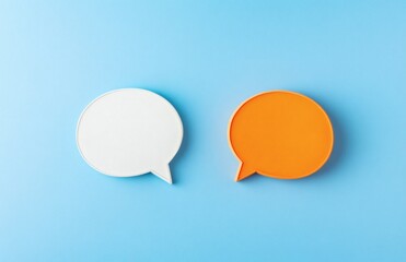 White and orange dialogs on blue background. Flat lay top view, discussion template. Communication concept, place for talk, idea and text