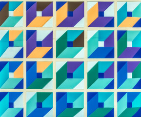 geometric mosaic artwork featuring a repeating pattern of interlocking triangles, arranged in a grid-like structure. The mosaic tiles creating a vibrant and eye-catching visual effect