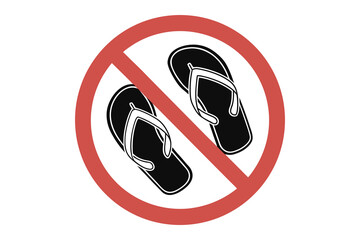Red prohibition circle with a diagonal line crossing over a pair of black flip flop sandals silhouette isolated on white background