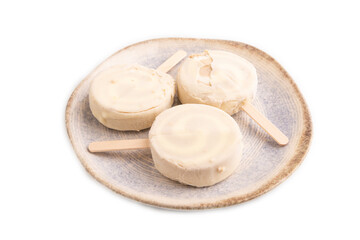 Сhocolate Ice cream in white glaze isolated on white, side view, close up