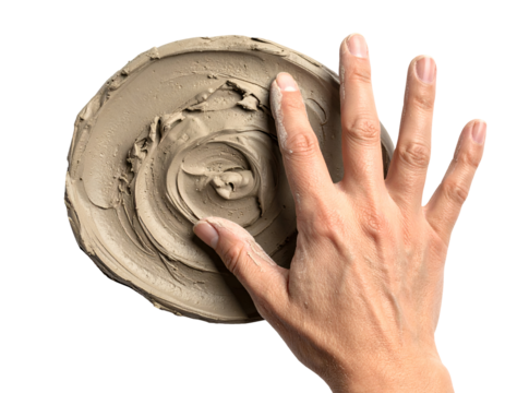 Hand spreading thick clay mask in a swirl pattern on isolated white background
