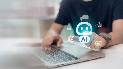 User interacting with AI assistant icon on laptop screen. Concept of chatbot interface, artificial intelligence, smart automation, virtual assistant, and machine learning technology.