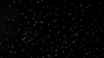 A timeless and elegant black and white fine art photograph.  The image is an abstract background with scattered white specks. It has soft contrast and saturation