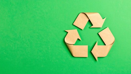 Recycled paper arrows forming a recycling symbol on a green background (3)