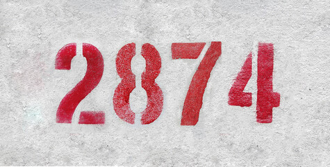 Red Number 2874 on the white wall. Spray paint.