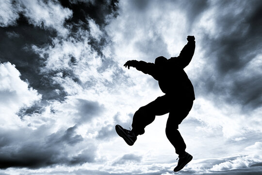 Urban parkour practice at dusk in a dynamic environment