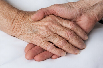 Fototapeta premium Sympathy expressed through a gentle hand touch in quiet moment