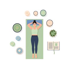 girl lying on a yoga mat