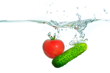 Fresh Tomato and Cucumber Splashing in Clear Water with Bubbles