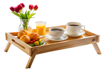 A delightful breakfast tray featuring fresh croissants, coffee, juice, and a vibrant tulip bouquet, perfect for a relaxing morning isolated on transparent background