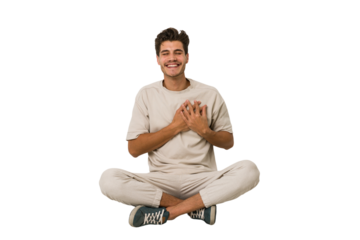 Young caucasian man sitting on the floor isolated on white background laughing keeping hands on heart, concept of happiness.