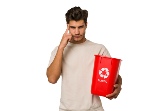Young caucasian man holding a plastic trash isolated pointing temple with finger, thinking, focused on a task.