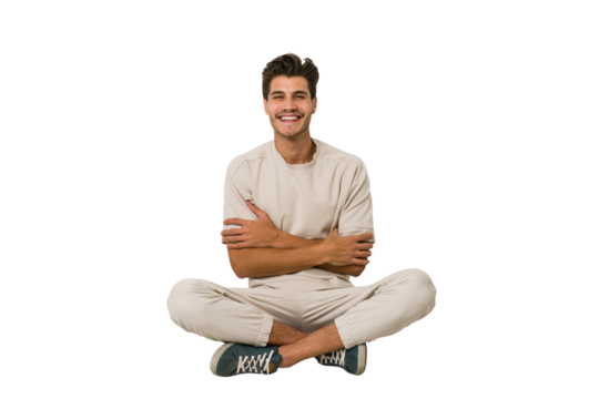 Young caucasian man sitting on the floor isolated on white background who feels confident, crossing arms with determination.