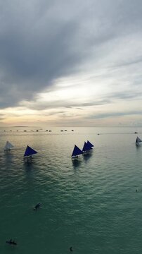 Traditional Paraw Sailboat at Sunset - Philippine Beach Drone Shot Above