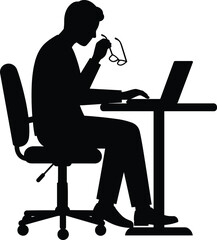 Silhouette of a Thoughtful Man Working on Laptop at Desk, Representing Business, Study, Concentration, and Remote Work Productivity.
