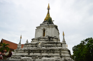 Fototapeta premium White Pagoda, Lanna Architecture, Symbols of Buddhism, South East Asia at Wat Chang Kam or Wat Kan Thom, Wiang Kum Kam Chiang Mai, Northern Thailand
