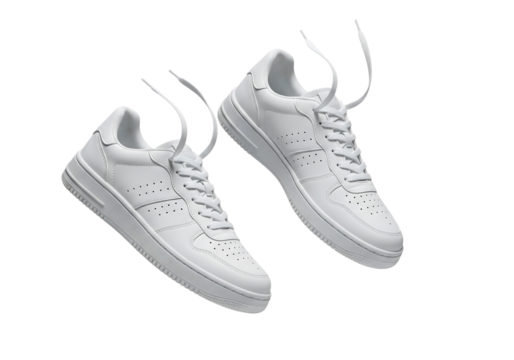 Pair of new white leather sneakers with untied shoelaces floating in the air. Isolated on transparent background, png