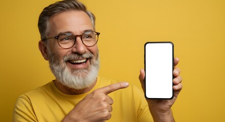 Smiling Mature Man Presenting Blank Smartphone Screen on Yellow Background