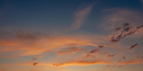 Stunning sunset paints the sky with vibrant hues of orange and blue.