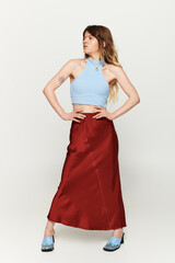 Summer vibes with a young woman expressing style and confidence in a vibrant outfit