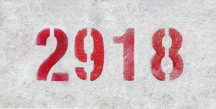 red spray-painted number 2918 sprayed onto a white wall.