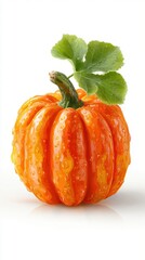 Bright orange pumpkin with water droplets resting on a reflective surface in a bright environment