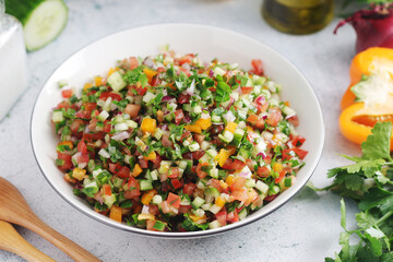 A bowl with traditional Israeli Salad