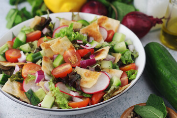 A bowl with Fattoush - Traditional Levantine salad