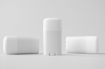 White plastic deodorant or balm stick mockup on neutral background