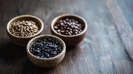 Rustic wooden bowls with mixed peppercorns on aged surface representing spices culinary seasoning variety