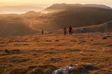 Obraz premium Couple in Love Enjoying the View at the Top of a Mountain.