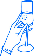 A cocktail glass garnished with fresh fruits on a beachside table