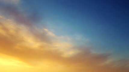 Obraz premium A beautiful gradient sky showcasing a blend of blue, orange, and soft clouds during sunset, perfect for tranquil backgrounds.