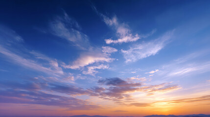 Obraz premium A captivating sunset sky filled with vibrant colors and delicate clouds, perfect for inspiring calm and tranquility in landscapes.