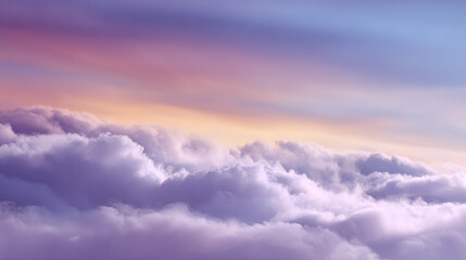 Obraz premium A serene view of soft clouds illuminated by pastel colors during sunset, creating a calming atmosphere for nature lovers.
