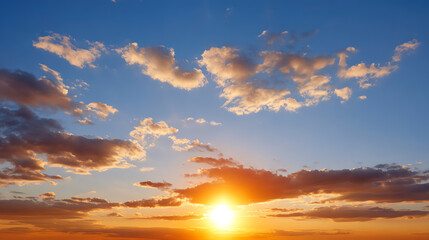 Fototapeta premium A stunning sunset illuminating the sky with vibrant colors, showcasing nature's beauty at dusk over a serene landscape.