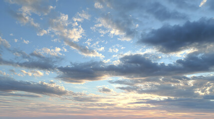 Obraz premium A tranquil sky at sunset, showcasing a blend of soft pastel colors and fluffy clouds, perfect for nature enthusiasts and landscape lovers.