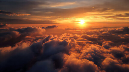 Fototapeta premium Breathtaking sunset view above the clouds, showcasing vibrant colors and serene atmosphere. Perfect for tranquil imagery.