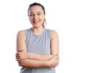 Confident smiling young woman with crossed hands