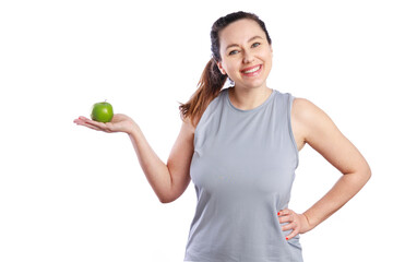 Smiling woman holding a green apple. Healthy lifestyle and nutrition
