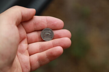 Coins of South Africa in hand