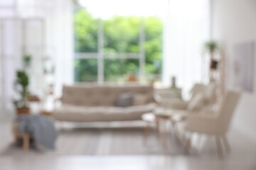 Blurred view of stylish furniture in living room. Interior design
