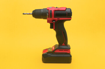 Compact DIY screwdriver pops against yellow background. Ergonomic shape and simple controls....