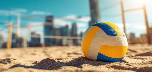 The vibrant volleyball resting on the sandy beach under a bright sun.