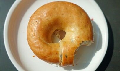 Freshly Baked Bagel Served on a White Plate